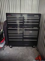 Full view of the stacked Craftsman rolling tool chest showing drawers and casters