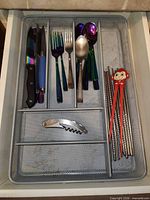 Top view of organizer and all utensils arranged in compartments