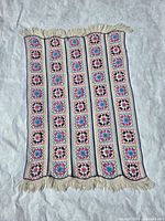 Full view of afghan showing overall pattern and fringe