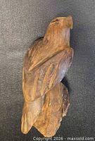 Left side view of carved wooden eagle