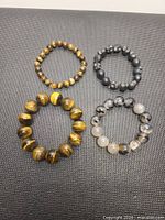 Top view showing all four bracelets laid flat