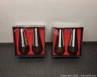 Two boxed pairs of Lundtofte wood and stainless shakers front view