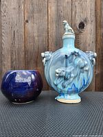 Moon flask front view beside bowl