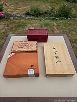 All four boxes closed showing exterior designs and sizes