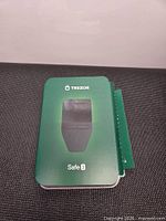 Front of green Trezor Safe 3 retail box