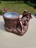 Full view of planter showing tree-stump cup, girl figurine, and liner