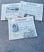 Three Whig-Standard newspapers laid out showing full front pages