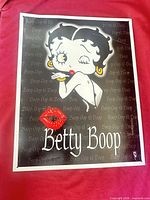 Front of Betty Boop tin sign showing full graphic and border