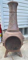 full view of cast iron chiminea showing overall design and condition