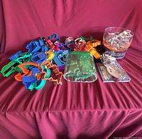 Overview of entire lot showing jar, loose plastic cutters and bowl of metal cutters