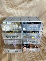 Front view of 8-drawer organizer filled with assorted buttons