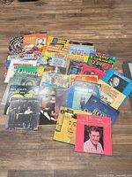 Group shot of entire assortment of records spread on floor