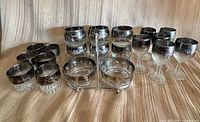 Full set showing tumblers, bowls in caddy, and goblets