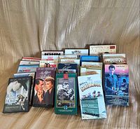 Front view of all VHS and DVD cases standing upright, showing variety of titles