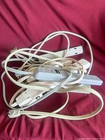Tangled group of power bars showing cords and plugs