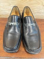 Front view showing black leather uppers and metal BM bit hardware