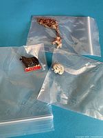 All three jewellery items in separate plastic bags