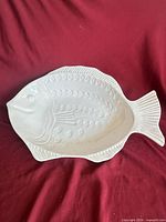 Top view of white ceramic fish-shaped platter showing full shape and detailing