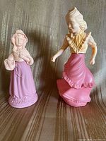 Front view of both Avon figural cologne bottles showing overall design and color