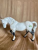 Left side view showing full figurine