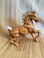side view showing full horse figurine profile and glaze colors