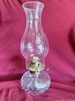 Full view of oil lamp showing chimney, burner and hobnail base