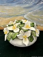 Front view of bone china floral bowl showing trillium flowers and bowl shape