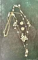 Necklace and earrings laid flat showing full set