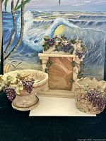 Group shot of frame, bowl and planter showing style and scale