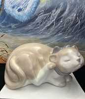 Front left view showing cat pose, colors, glossy finish