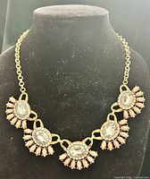 Front view of LOFT statement bib necklace on black bust