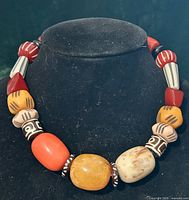 Necklace on display stand showing full length and bead arrangement