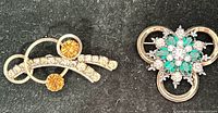 Front view of both brooches