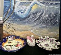Group shot of all three porcelain items in front of painting