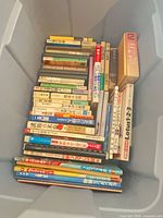 Top view of entire lot inside plastic bin showing quantity and variety