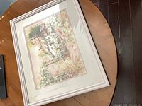 Entire framed print on table