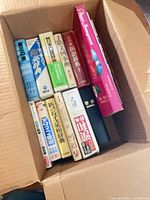 All twelve books inside shipping box, top view