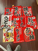 Overhead of eight Japanese food banners laid out