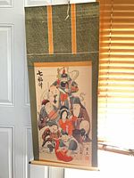 full view of scroll showing mount, artwork and roller