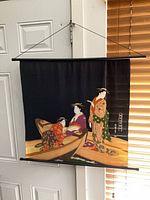 Full view of wall hanging scroll with rod and cord