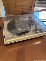 Full view of Kenwood KD-2055 turntable with dust cover closed