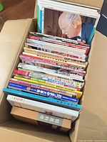 Top view of box showing spine edges of all cookbooks