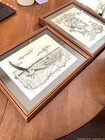 Both framed prints on tabletop showing overall appearance