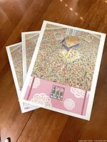 Front view of three identical jigsaw puzzle boxes with illustration