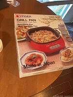 Retail box showing Tiger CGS-1200 grill pan image and Made in Japan text
