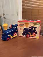 Locomotive beside original box