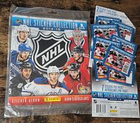 Front view of sealed album with four sticker packs