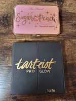 Front view of both closed palettes showing branding