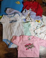 Group shot of all nine baby garments spread out