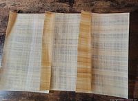 Three papyrus sheets side by side showing overall color and fiber pattern